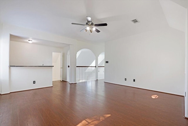 empty room featuring ceiling fan and dark hardwood / wood-style floors