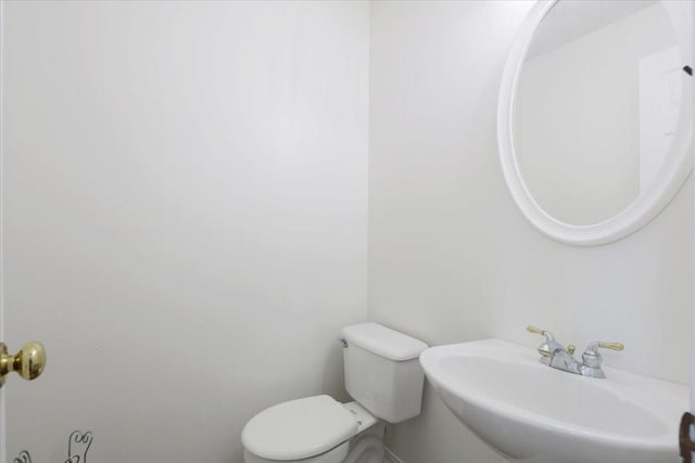 bathroom featuring sink and toilet