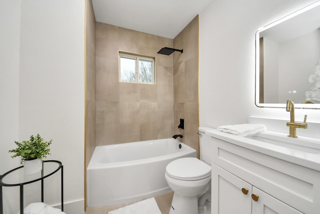 full bathroom featuring tiled shower / bath combo, vanity, and toilet