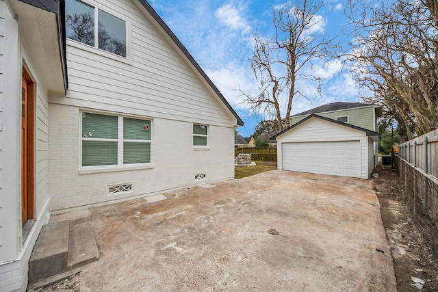 view of side of property with a garage and an outdoor structure