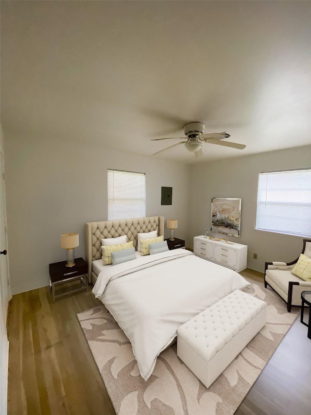 bedroom with hardwood / wood-style flooring and ceiling fan