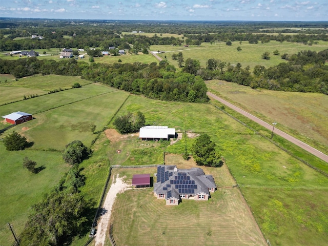 birds eye view of property with a rural view