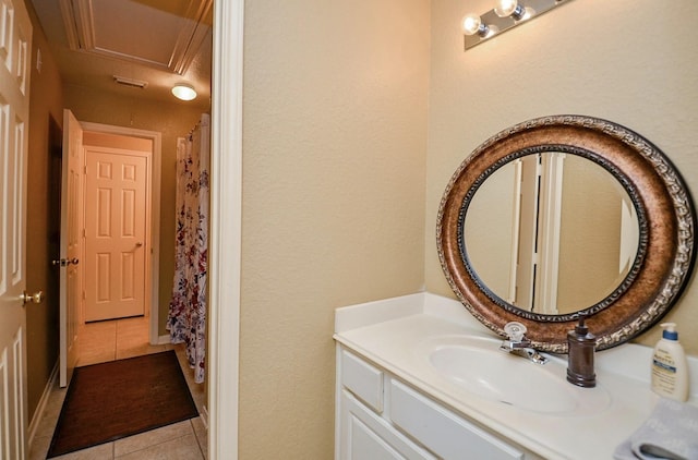 bathroom with tile patterned flooring and vanity