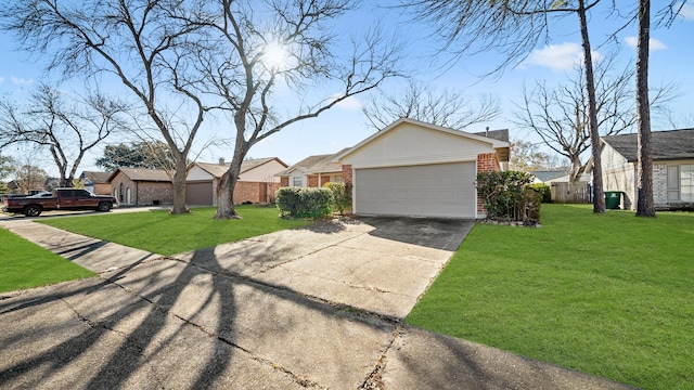 view of front of house featuring a garage and a front lawn