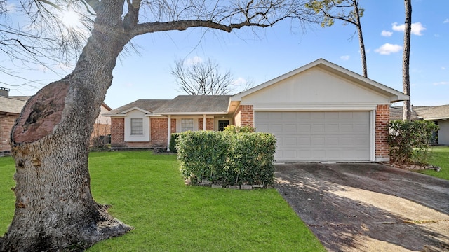 single story home with a garage and a front lawn