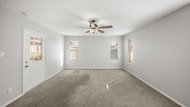 carpeted empty room with ceiling fan