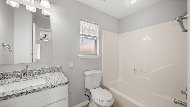 full bathroom featuring toilet, ceiling fan, vanity, and bathtub / shower combination