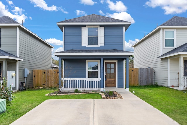 front of property with a front yard and covered porch