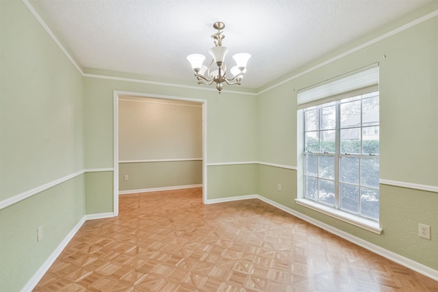 unfurnished room featuring an inviting chandelier, crown molding, a textured ceiling, and light parquet floors