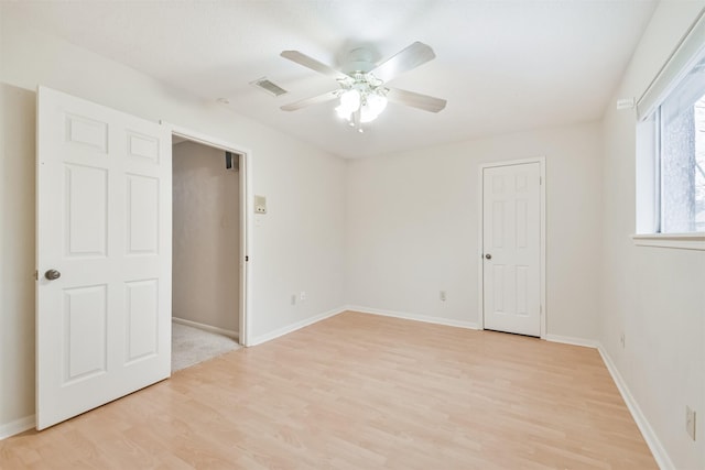 unfurnished bedroom with ceiling fan and light hardwood / wood-style floors