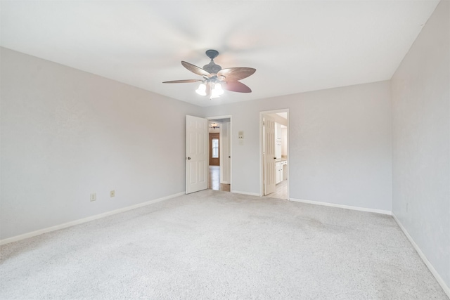 unfurnished room featuring ceiling fan and light carpet