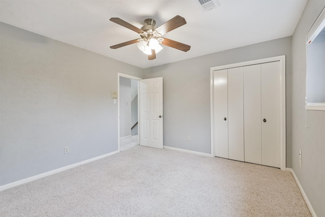 unfurnished bedroom with a closet and ceiling fan