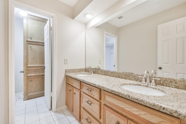 bathroom with vanity and tile patterned floors