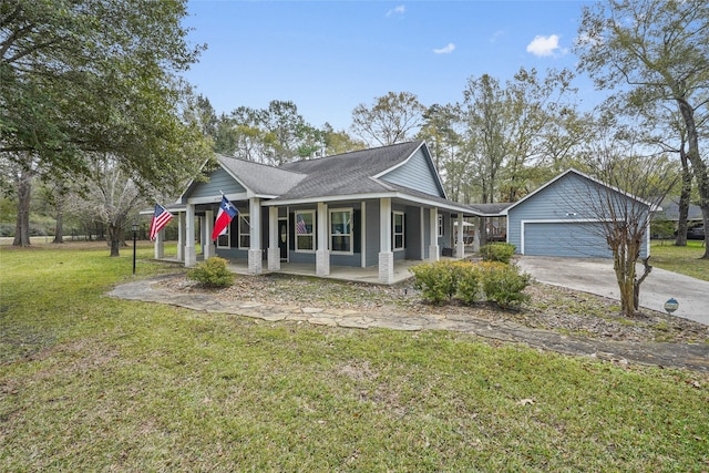 view of front of property with a garage, a front yard, and a porch