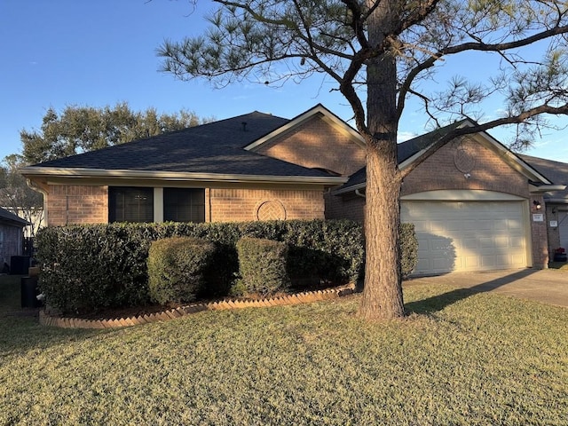 exterior space featuring a garage and a front yard