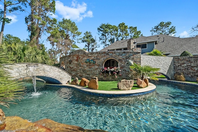 view of pool featuring pool water feature