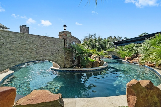 view of swimming pool featuring pool water feature