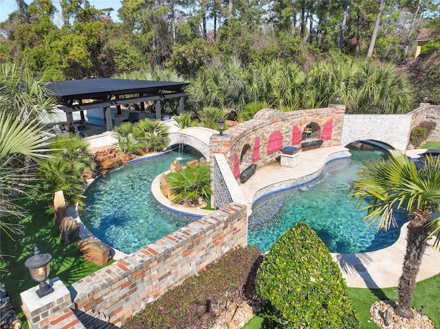 view of pool featuring a gazebo, a patio, and an outdoor fireplace