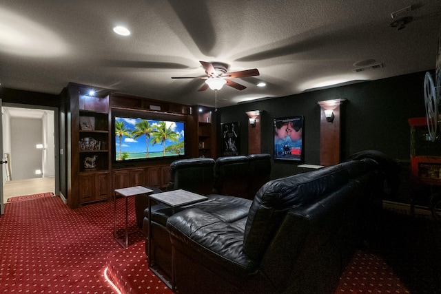 home theater room with carpet flooring, a textured ceiling, and ceiling fan