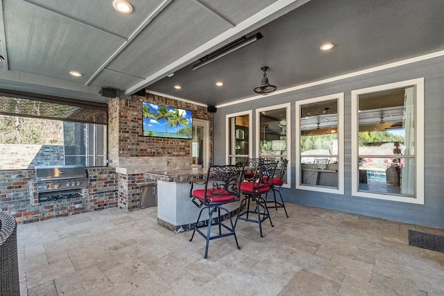 view of patio with area for grilling and grilling area