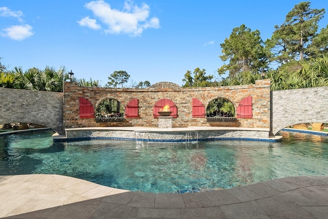 view of swimming pool with pool water feature