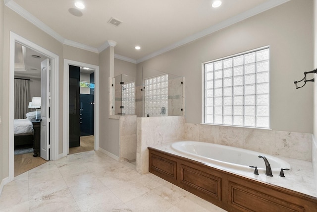 bathroom featuring ornamental molding and separate shower and tub