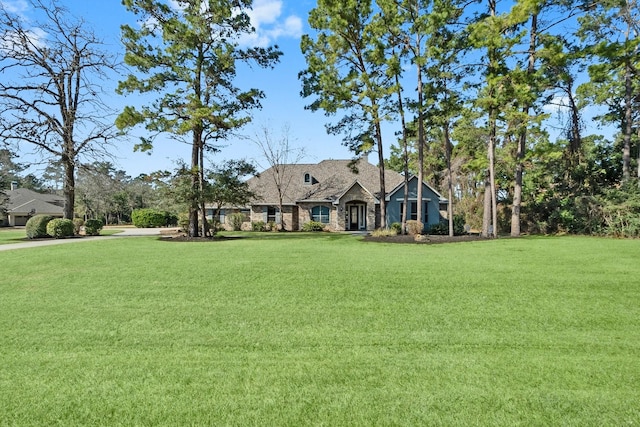 view of front of home with a front yard