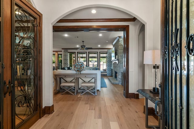 foyer entrance featuring ceiling fan and light hardwood / wood-style floors