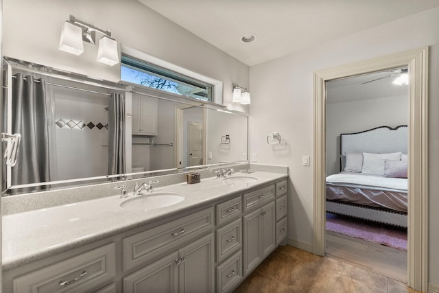 bathroom with vanity, tile patterned floors, and a shower with shower curtain