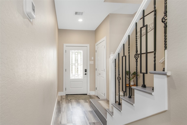 entrance foyer with light hardwood / wood-style floors