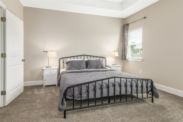 bedroom featuring dark carpet