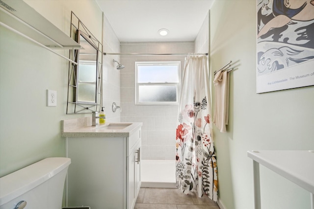 bathroom featuring tile patterned flooring, vanity, toilet, and a shower with shower curtain