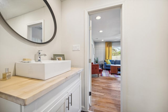 bathroom featuring vanity and hardwood / wood-style floors