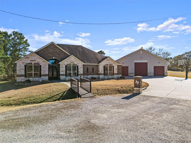 view of front of home with a garage and a front lawn