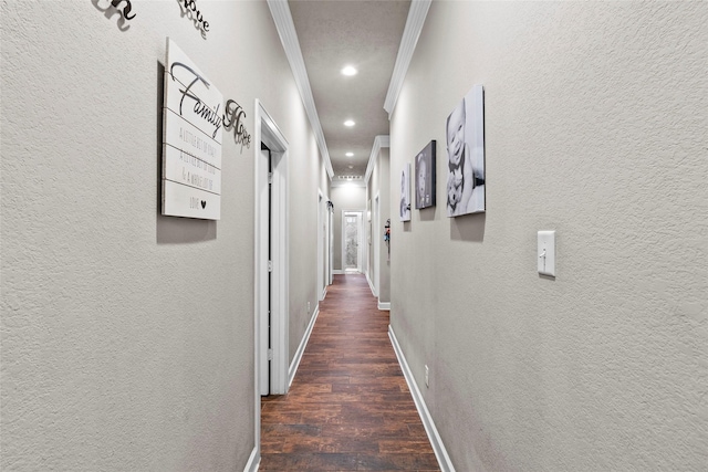 corridor with dark wood-type flooring and ornamental molding