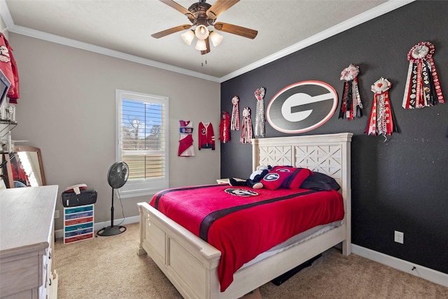 carpeted bedroom with crown molding and ceiling fan