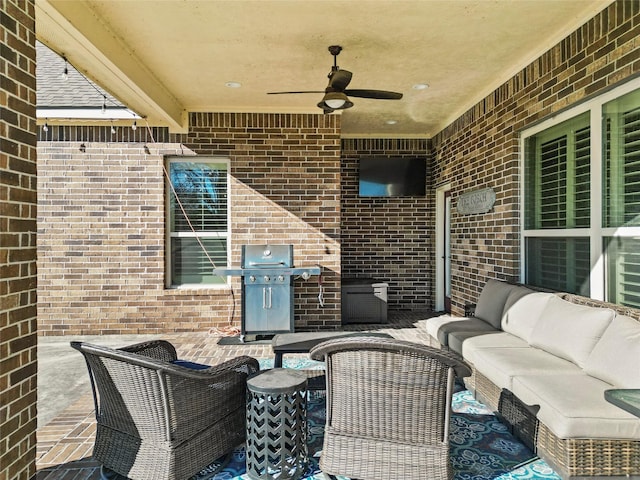 view of patio / terrace with an outdoor living space, grilling area, and ceiling fan