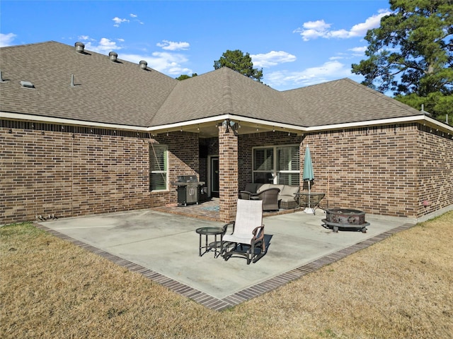 view of patio / terrace with a grill and an outdoor living space with a fire pit