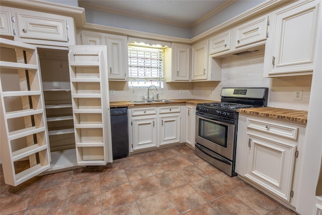 kitchen with butcher block countertops, black dishwasher, sink, crown molding, and stainless steel gas range oven