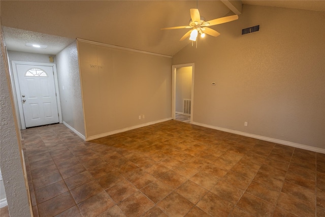 unfurnished room featuring vaulted ceiling with beams and ceiling fan