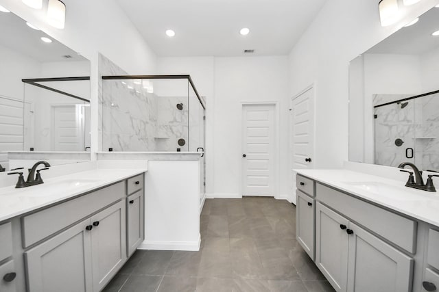 bathroom featuring an enclosed shower and vanity