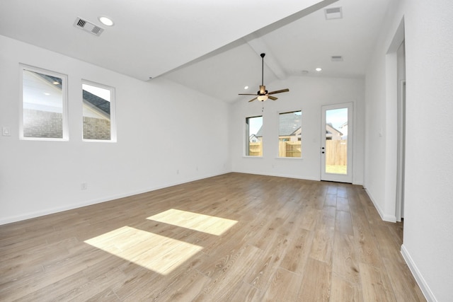 unfurnished living room with vaulted ceiling with beams, light hardwood / wood-style flooring, and ceiling fan