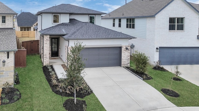 view of front facade featuring a garage and a front yard