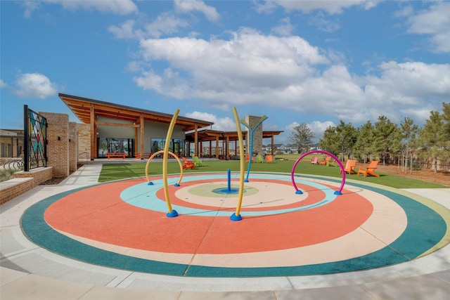 view of community featuring a playground and a lawn