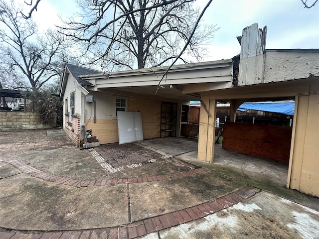 exterior space featuring a carport