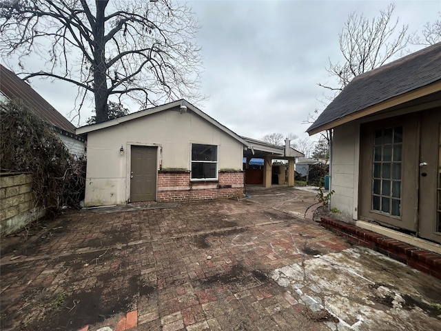 view of property exterior featuring a patio