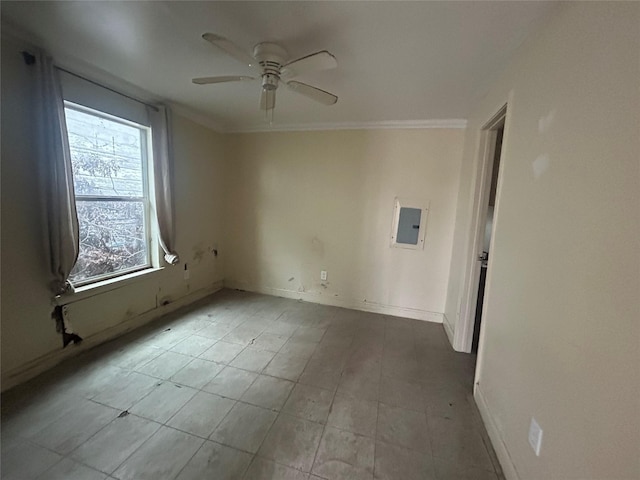 spare room featuring crown molding, electric panel, and ceiling fan