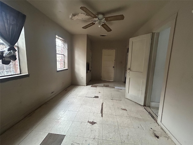 empty room featuring ceiling fan