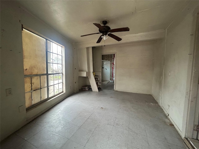 unfurnished room with ceiling fan