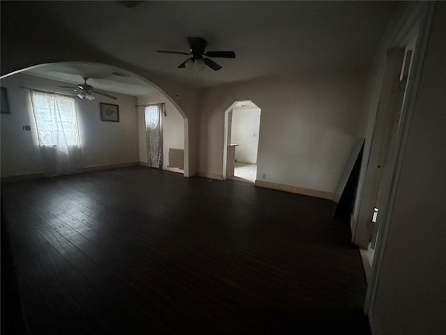 spare room with ceiling fan and dark hardwood / wood-style floors